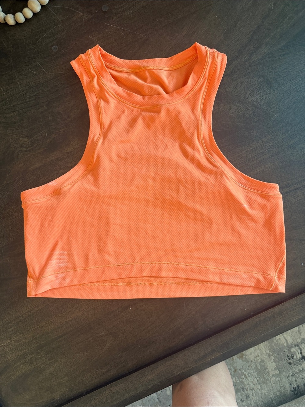 Lululemon Women's Crop Tank Top - Orange. Open slit in back.